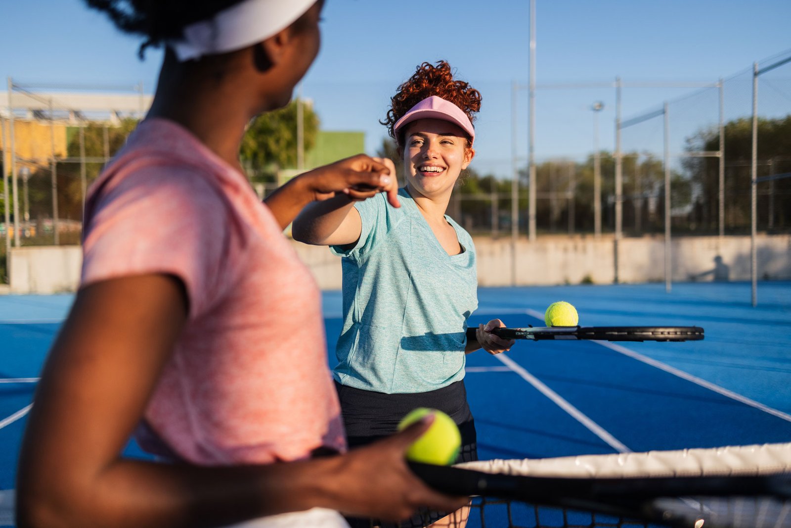 Tennis professionals on court