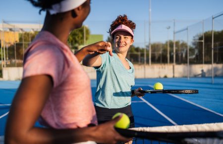 Tennis professionals on court